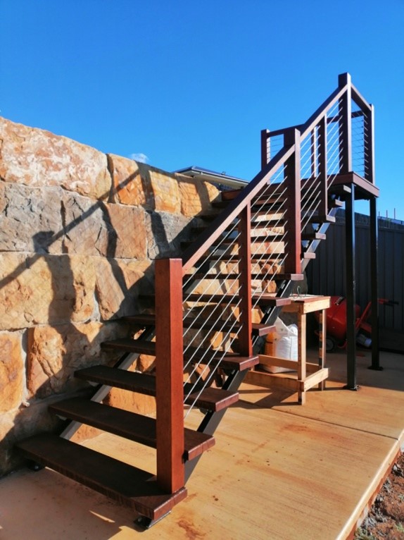 Powder coated steel stringers on these outdoor stairs